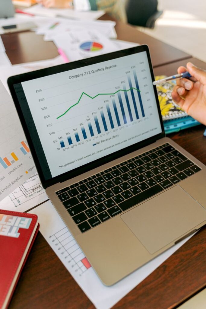pexels photo 5466250 A close-up view of a laptop displaying business analytics and revenue charts.